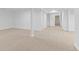 Spacious finished basement with neutral carpet and bright, white walls at 3871 E Euclid Ave, Centennial, CO 80121