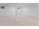 Large carpeted basement area with support beam at 3871 E Euclid Ave, Centennial, CO 80121