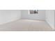 Bright, carpeted bedroom with a view from a sunny window at 3871 E Euclid Ave, Centennial, CO 80121