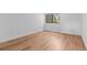 Spacious room showcasing sleek, wood-look floors and a sunlit window at 3871 E Euclid Ave, Centennial, CO 80121