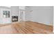 Spacious living room features hardwood floors, a fireplace, and an open floor plan at 3871 E Euclid Ave, Centennial, CO 80121