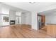 Expansive living area featuring hardwood floors, a fireplace, high ceilings, and an open layout to the modern kitchen at 3871 E Euclid Ave, Centennial, CO 80121