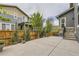 Concrete patio with wooden fence provides ample parking and outdoor entertaining space at 11771 W Quarles Ave, Littleton, CO 80127