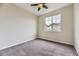 This bedroom features a ceiling fan and a window providing natural light at 11771 W Quarles Ave, Littleton, CO 80127