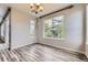 Bright dining room featuring hardwood floors and large windows offering plenty of natural light at 11771 W Quarles Ave, Littleton, CO 80127