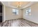 Formal dining room with hardwood floors, recessed lighting, and large windows at 11771 W Quarles Ave, Littleton, CO 80127