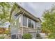 The home's exterior includes stone accents and complementary colored siding and trim at 11771 W Quarles Ave, Littleton, CO 80127