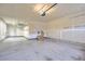 Spacious two-car garage with ample storage space and potential for organization at 11771 W Quarles Ave, Littleton, CO 80127