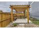 Wooden pergola with bench seating provides an inviting and relaxing outdoor space at 11771 W Quarles Ave, Littleton, CO 80127