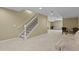Finished basement with staircase, neutral carpet, tan walls, and recessed lighting at 23426 Briar Leaf Ave, Parker, CO 80138