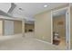 Finished basement features neutral carpet, recessed lighting, and an adjacent bathroom at 23426 Briar Leaf Ave, Parker, CO 80138