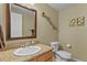 This bathroom boasts granite countertops, a decorative mirror, and stylish wall decor at 23426 Briar Leaf Ave, Parker, CO 80138