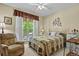 Cozy bedroom with large window offering lots of natural light at 23426 Briar Leaf Ave, Parker, CO 80138