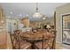 Open dining area with a large round table and convenient access to kitchen and living areas at 23426 Briar Leaf Ave, Parker, CO 80138