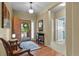 Welcoming foyer with hardwood floors, front door, and stylish decor at 23426 Briar Leaf Ave, Parker, CO 80138
