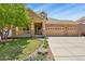 Charming two-story home with manicured lawn, brick accents, and spacious three car garage at 23426 Briar Leaf Ave, Parker, CO 80138