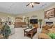 Inviting living room features a fireplace, media center, and multiple seating areas at 23426 Briar Leaf Ave, Parker, CO 80138