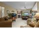 Large living room featuring a cozy fireplace and comfortable seating at 23426 Briar Leaf Ave, Parker, CO 80138