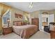 Spacious main bedroom featuring a ceiling fan, natural light, and ensuite bathroom at 23426 Briar Leaf Ave, Parker, CO 80138