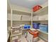 Storage space features multiple shelves holding plastic containers and boxes at 23426 Briar Leaf Ave, Parker, CO 80138