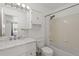 Bright bathroom features a marble vanity and shower-tub combination at 408 Sylvestor Trl, Highlands Ranch, CO 80129