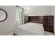 Bright bedroom featuring a comfortable bed, dresser, and scenic views from the window at 408 Sylvestor Trl, Highlands Ranch, CO 80129
