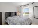 Bright bedroom features a comfortable bed with scenic views from the window at 408 Sylvestor Trl, Highlands Ranch, CO 80129