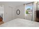 Bright bedroom features a closet and dresser with scenic views from the window at 408 Sylvestor Trl, Highlands Ranch, CO 80129