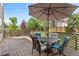 Relax on this charming deck with comfortable seating and a large sun umbrella at 408 Sylvestor Trl, Highlands Ranch, CO 80129