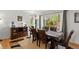 Inviting dining room features a dark wood table and large window with views of the outdoors at 408 Sylvestor Trl, Highlands Ranch, CO 80129
