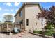 Charming home featuring a backyard patio, flower beds, and manicured landscape at 408 Sylvestor Trl, Highlands Ranch, CO 80129