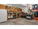 Spacious garage with pegboard wall and shelving provides ample storage at 408 Sylvestor Trl, Highlands Ranch, CO 80129