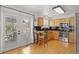Bright eat-in kitchen boasting stainless steel appliances, wood cabinets, and a door to the deck at 408 Sylvestor Trl, Highlands Ranch, CO 80129