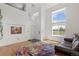 Bright open-concept living room featuring soaring ceilings and hardwood flooring at 408 Sylvestor Trl, Highlands Ranch, CO 80129