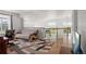 Open loft features comfortable seating, wood floors, staircase, and lots of natural light at 408 Sylvestor Trl, Highlands Ranch, CO 80129