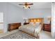 Spacious main bedroom with plush carpeting, ceiling fan, and ample closet space at 408 Sylvestor Trl, Highlands Ranch, CO 80129