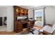 Spacious office featuring hardwood floors, a built-in desk, and a cozy sofa at 408 Sylvestor Trl, Highlands Ranch, CO 80129