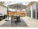 Relaxing outdoor dining area with a patio umbrella, barbecue grill and sliding glass doors to the interior at 350 Adams St, Denver, CO 80206