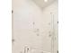 Modern bathroom showcasing a glass-enclosed shower with white marble tile surround at 350 Adams St, Denver, CO 80206