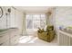 Bright Bedroom featuring a wide window, comfortable chair and custom storage solutions at 350 Adams St, Denver, CO 80206