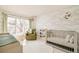Stylishly decorated Bedroom featuring a crib, comfortable chair and large windows offering natural light at 350 Adams St, Denver, CO 80206