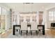 Bright dining room with contemporary chandelier and access to outdoor space at 350 Adams St, Denver, CO 80206