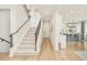 Bright entryway with hardwood floors, staircase and a view of the kitchen at 350 Adams St, Denver, CO 80206
