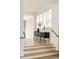 Bright hallway with hardwood floors, white trim, and a decorative console table at 350 Adams St, Denver, CO 80206