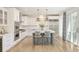 Modern kitchen features white cabinets, stainless steel appliances, and a center island at 350 Adams St, Denver, CO 80206