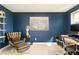 Comfortable home office featuring a padded chair, contemporary desk, and an accent wall at 350 Adams St, Denver, CO 80206