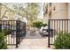 Outdoor patio space with stone flooring, black metal fencing, and comfortable seating for relaxing and entertaining guests at 350 Adams St, Denver, CO 80206