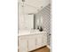 Stylish powder room features modern vanity and patterned wallpaper at 350 Adams St, Denver, CO 80206