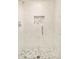 Updated walk-in shower featuring decorative mosaic tile flooring and built-in niche at 350 Adams St, Denver, CO 80206