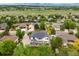 Aerial view of the property with a large backyard, nestled in a neighborhood with mountain views at 1311 Fletcher Dr, Erie, CO 80516
